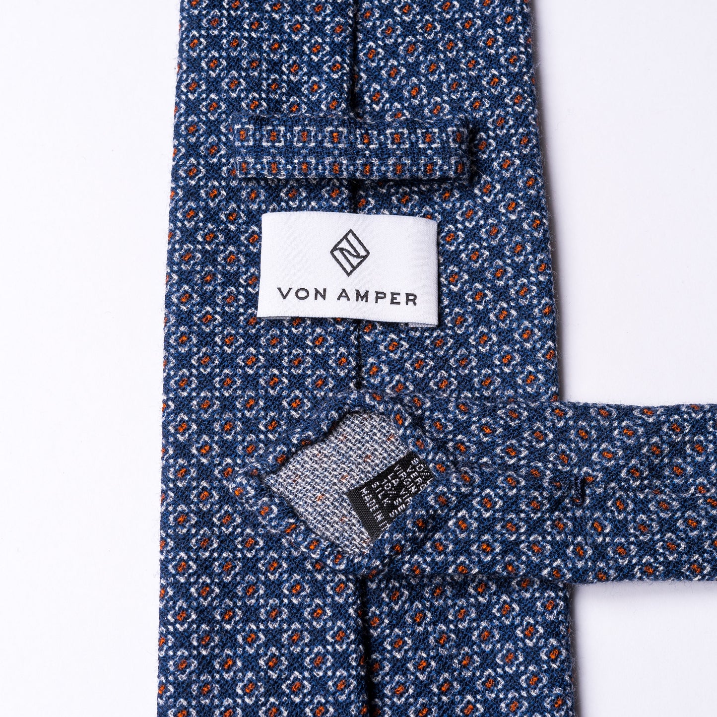Dunkelblaue Krawatte aus Wolle mit Blumenmuster