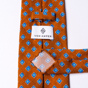 Krawatte in Orange  mit blauem Blumenmuster
