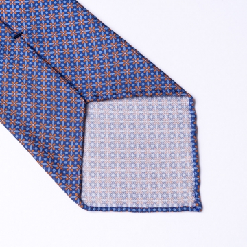 Blaue Krawatte aus Seide  mit orangenem Blumenmuster.